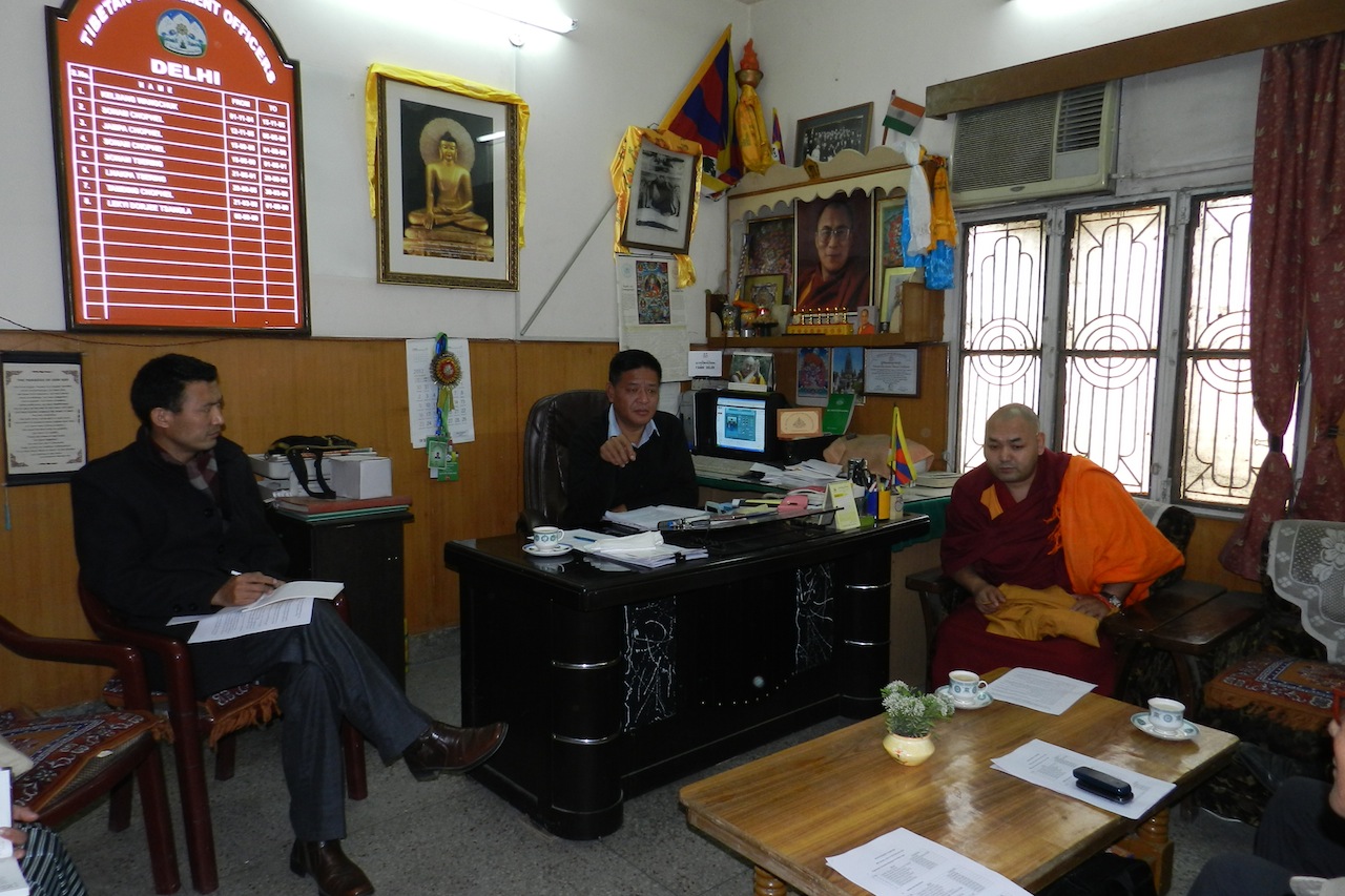 Speaker Penpa Tsering and Tibetan Parliament members at a general meeting